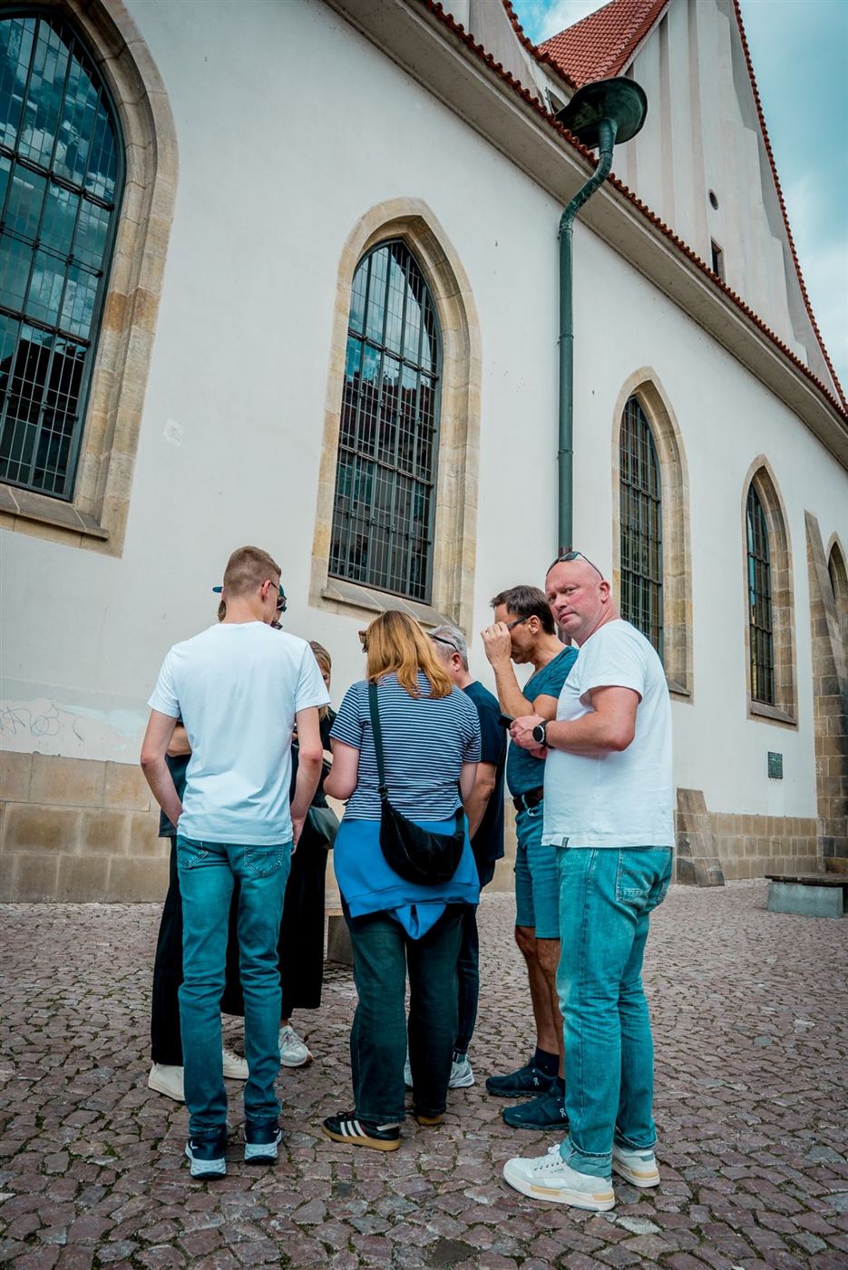 A team gathered beside Bethlehem Chapel