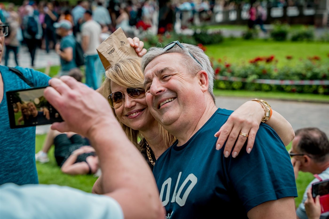 Two colleagues laughing during a photo challenge