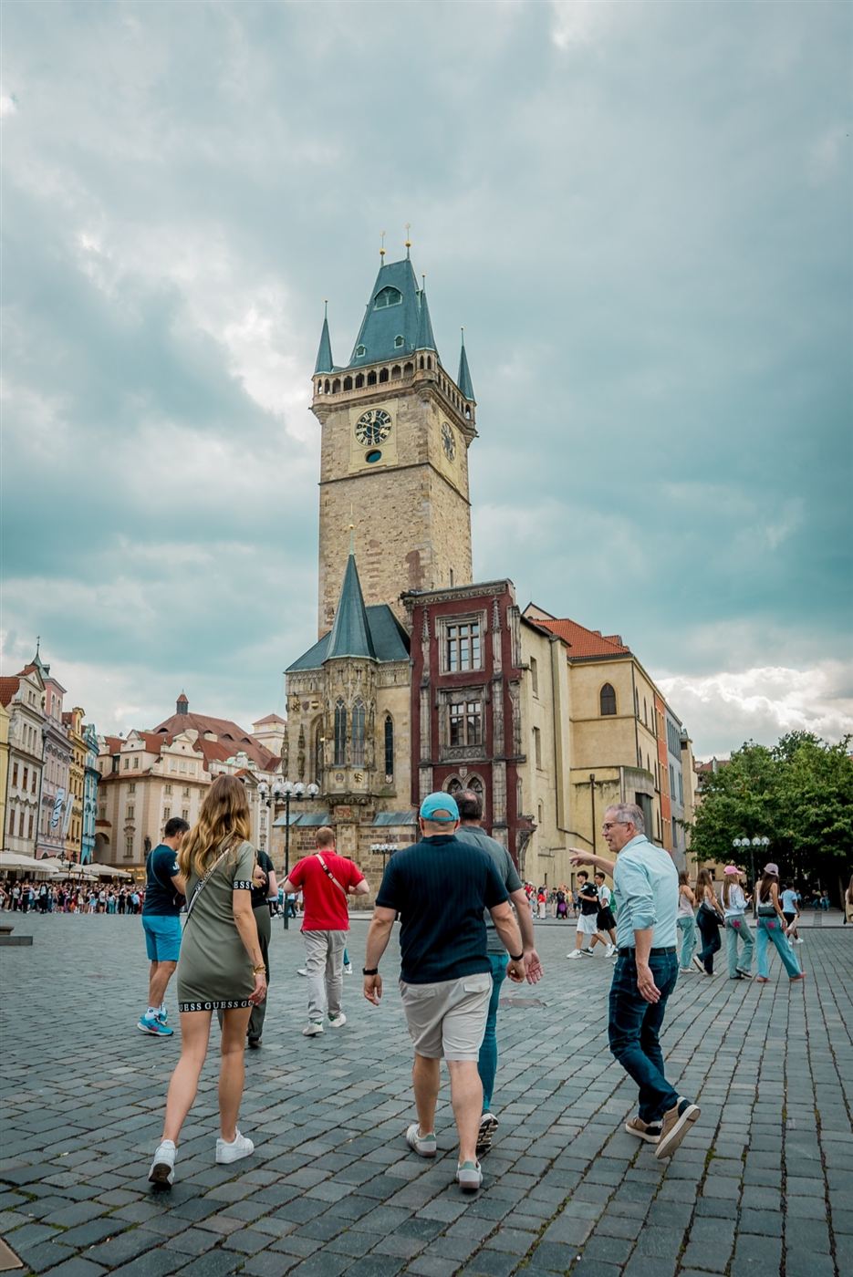A team heading across Old Town Square towards the Old Town Hall tower